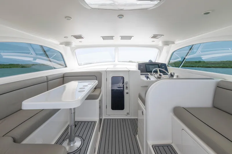 Slide: The Image of Interior of 2008 Ocean Yacht 37 Billfish, featuring sleek seating and modern helm. - 13