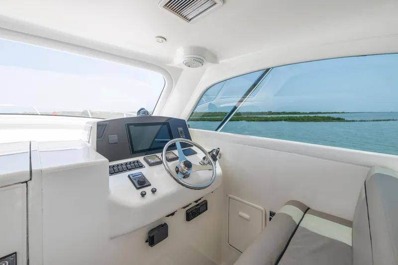Slide: The Image of Interior view of 2008 Ocean Yacht 37 Billfish helm with ocean backdrop. - 16