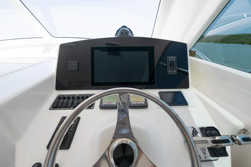 Slide: The Image of Steering console of 2008 Ocean Yacht 37 Billfish with modern navigation equipment. - 18