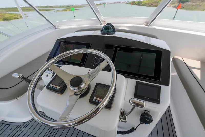 Slide: The Image of Steering console of 2008 Ocean Yacht 37 Billfish with navigation instruments and controls. - 2