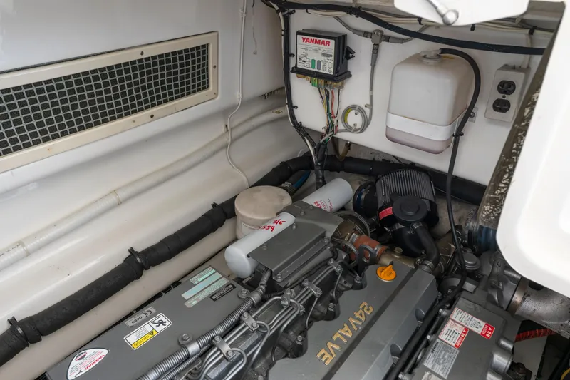 Slide: The Image of Engine room of a 2008 Ocean Yacht 37 Billfish, featuring a Yanmar engine. - 26