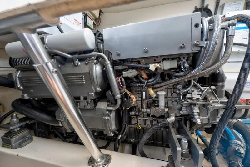 Slide: The Image of Engine compartment of a 2008 Ocean Yacht 37 Billfish, showcasing detailed mechanical components. - 27