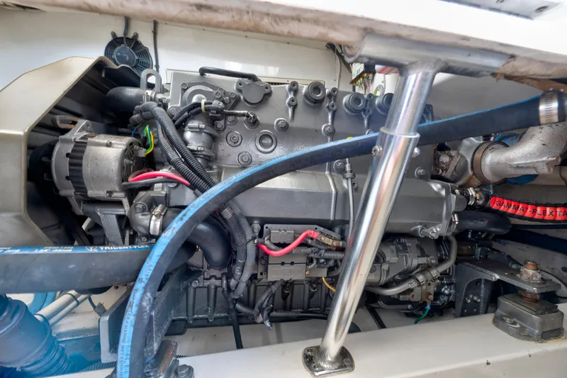 Slide: The Image of Engine compartment of a 2008 Ocean Yacht 37 Billfish, showcasing detailed mechanical components. - 28