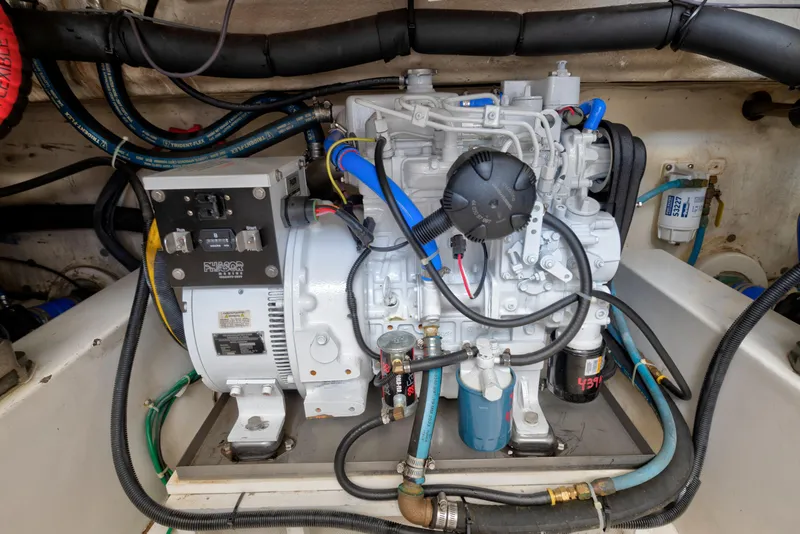 Slide: The Image of Engine compartment of a 2008 Ocean Yacht 37 Billfish, showcasing detailed mechanical components. - 29