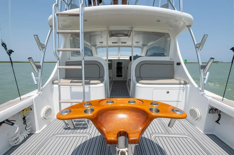 Slide: The Image of 2008 Ocean Yacht 37 Billfish interior with wooden table, ladder, and seating on open water. - 7
