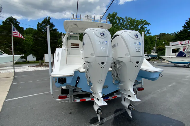 Slide: The Image of 2026 Pursuit DC 286 Dual Console boat with twin Yamaha 300 V6 engines. - 10