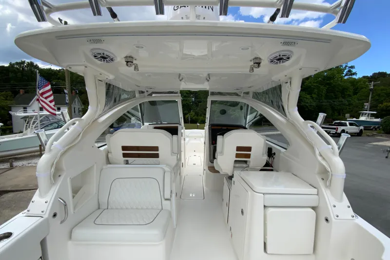 Slide: The Image of 2026 Pursuit DC 286 Dual Console boat interior with seating and storage. - 23