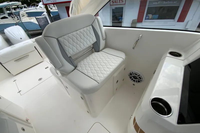 Slide: The Image of 2026 Pursuit DC 286 Dual Console boat interior with luxurious seating and modern design. - 27