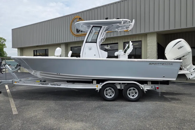 Slide: The Image of 2026 Sportsman Masters 247 Bay Boat on trailer outside dealership. - 1