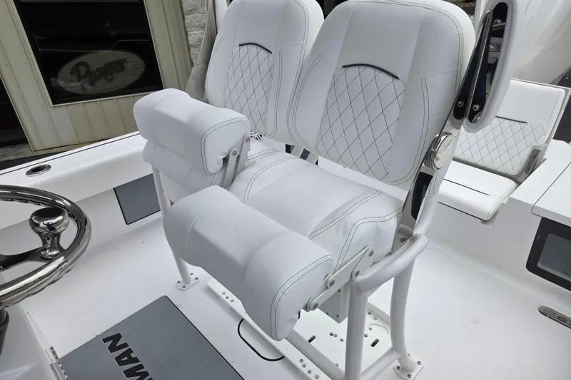 Slide: The Image of Luxurious seating on 2026 Sportsman Masters 247 Bay Boat, featuring elegant white upholstery. - 11
