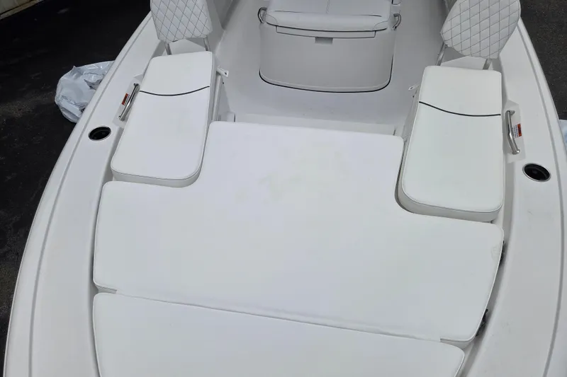 Slide: The Image of 2026 Sportsman Masters 247 Bay Boat with cushioned seating and storage compartments. - 12