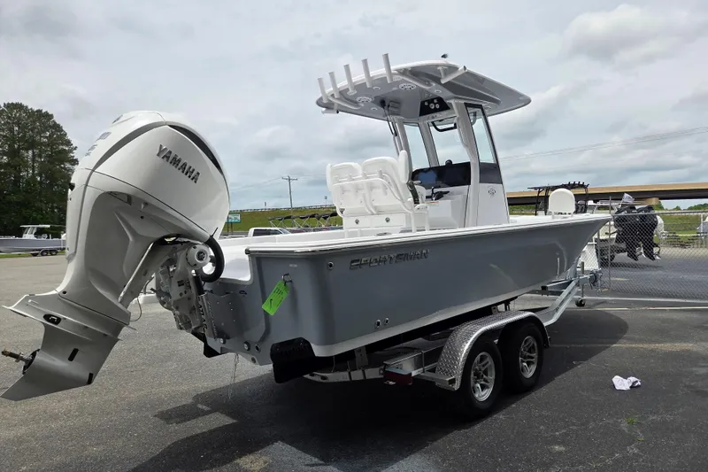 Slide: The Image of 2026 Sportsman Masters 247 Bay Boat with Yamaha engine on trailer, parked outdoors. - 4