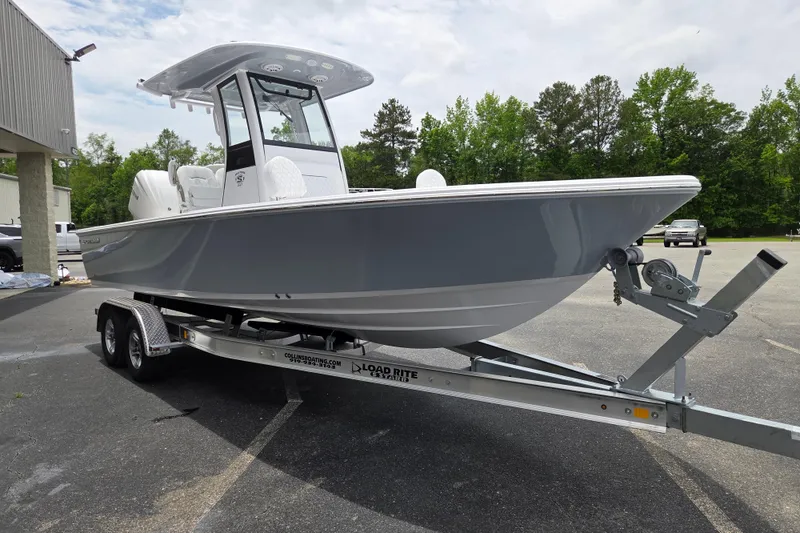 Slide: The Image of 2026 Sportsman Masters 247 Bay Boat on trailer, parked outdoors. - 6