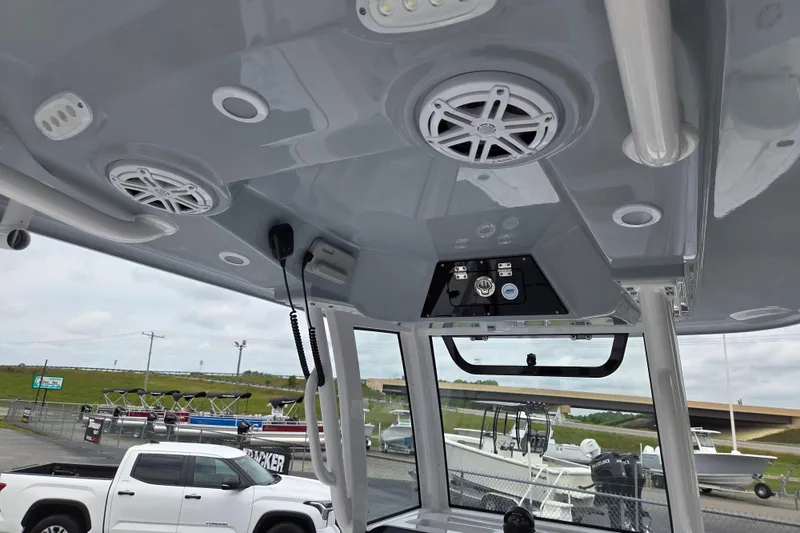 Slide: The Image of 2026 Sportsman Masters 247 Bay Boat interior with speakers and control panel. - 8