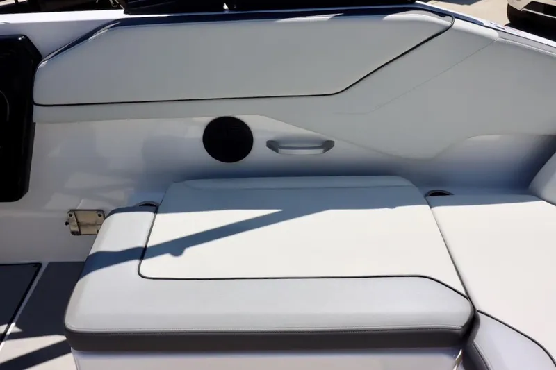 Slide: The Image of 2023 Yamaha Boats AR250 interior seating with sleek, modern design and comfortable upholstery. - 24