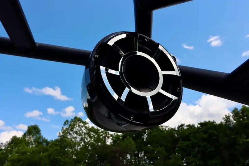 Slide: The Image of Close-up of Yamaha AR250 2023 boat speaker against blue sky and trees. - 30
