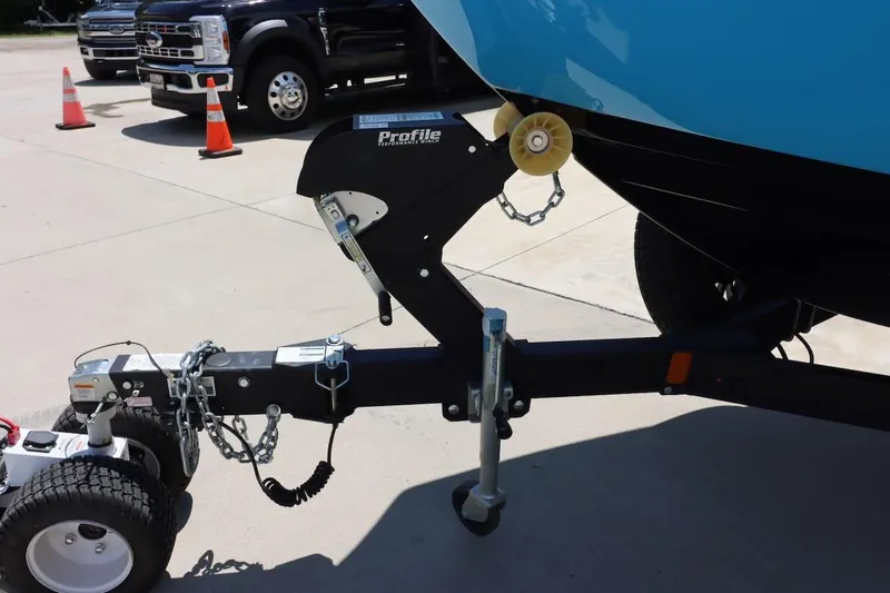 Slide: The Image of Trailer hitch of a 2023 Yamaha Boats AR250, parked on concrete with traffic cones nearby. - 33