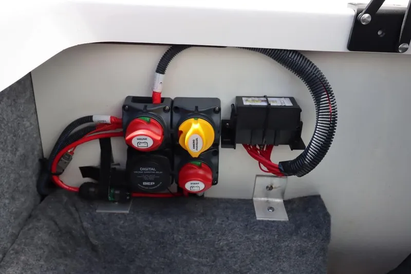 Slide: The Image of Electrical panel of 2023 Yamaha Boats AR250, featuring switches and wiring components. - 37