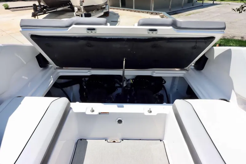 Slide: The Image of 2023 Yamaha Boats AR250 engine compartment with open hatch, showcasing interior details. - 38