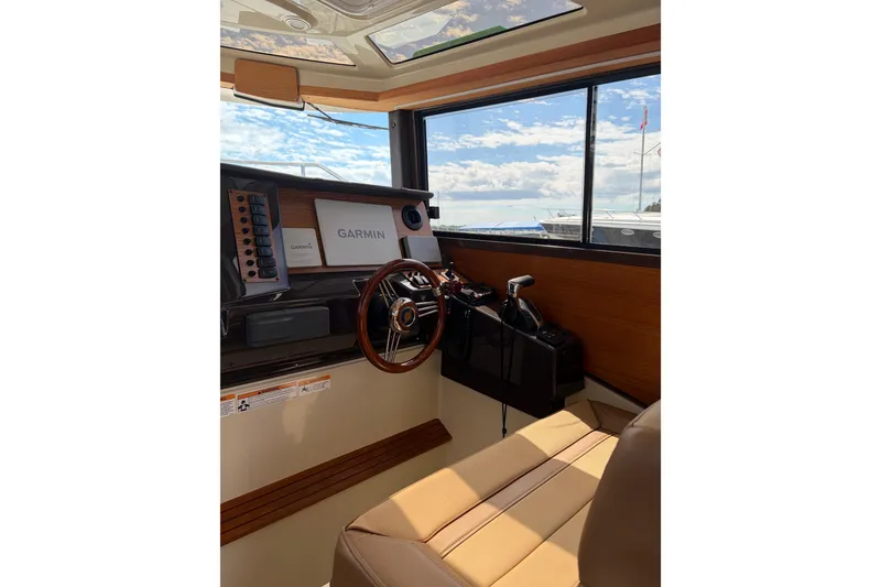 Slide: The Image of Interior of 2022 Ranger Tugs R-27 boat with Garmin navigation system. - 7