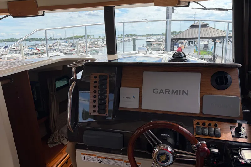 Slide: The Image of Interior view of 2022 Ranger Tugs R-27 helm with Garmin navigation system. - 8