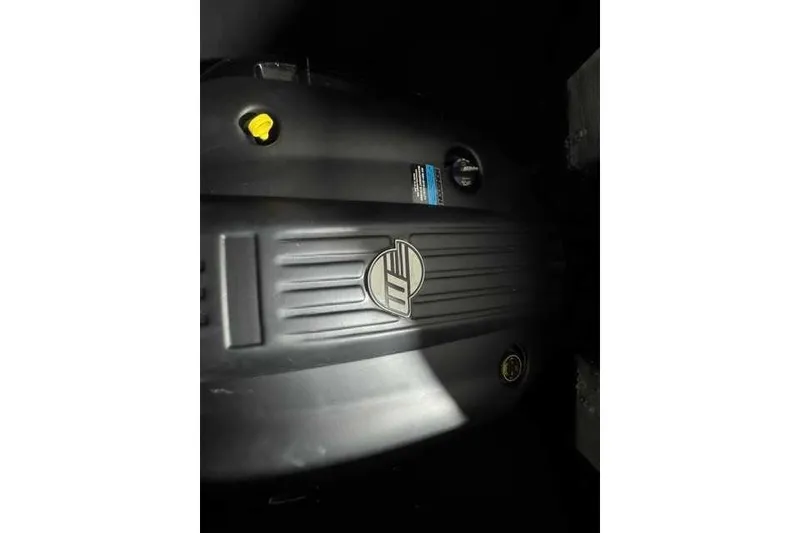 Slide: The Image of Engine cover of 2023 Malibu Wakesetter 25 LSV, featuring logo and design details. - 11