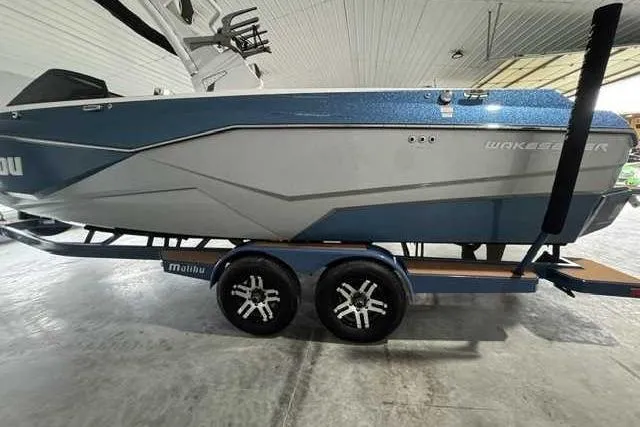 Slide: The Image of 2023 Malibu Wakesetter 25 LSV boat on trailer in indoor storage. - 4