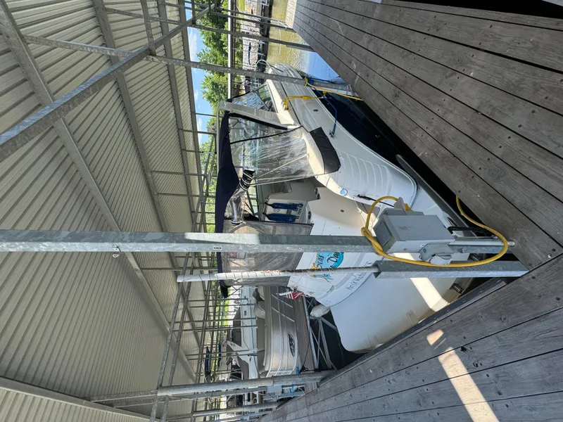 The Image of 2006 Rinker Fiesta Vee 300 boat docked in marina. - 0