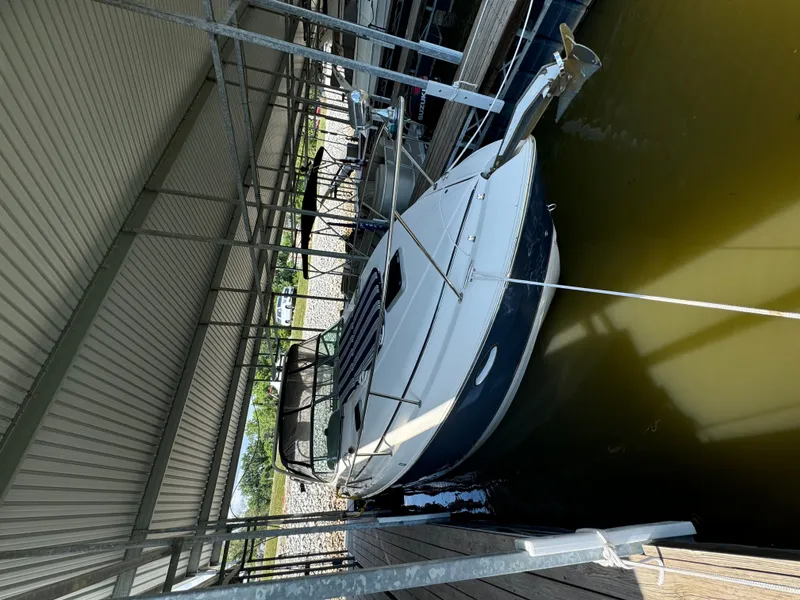 Slide: The Image of 2006 Rinker Fiesta Vee 300 boat docked in marina. - 1