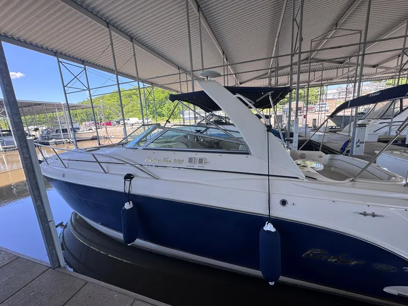 Slide: The Image of 2006 Rinker Fiesta Vee 300 boat docked in marina. - 12