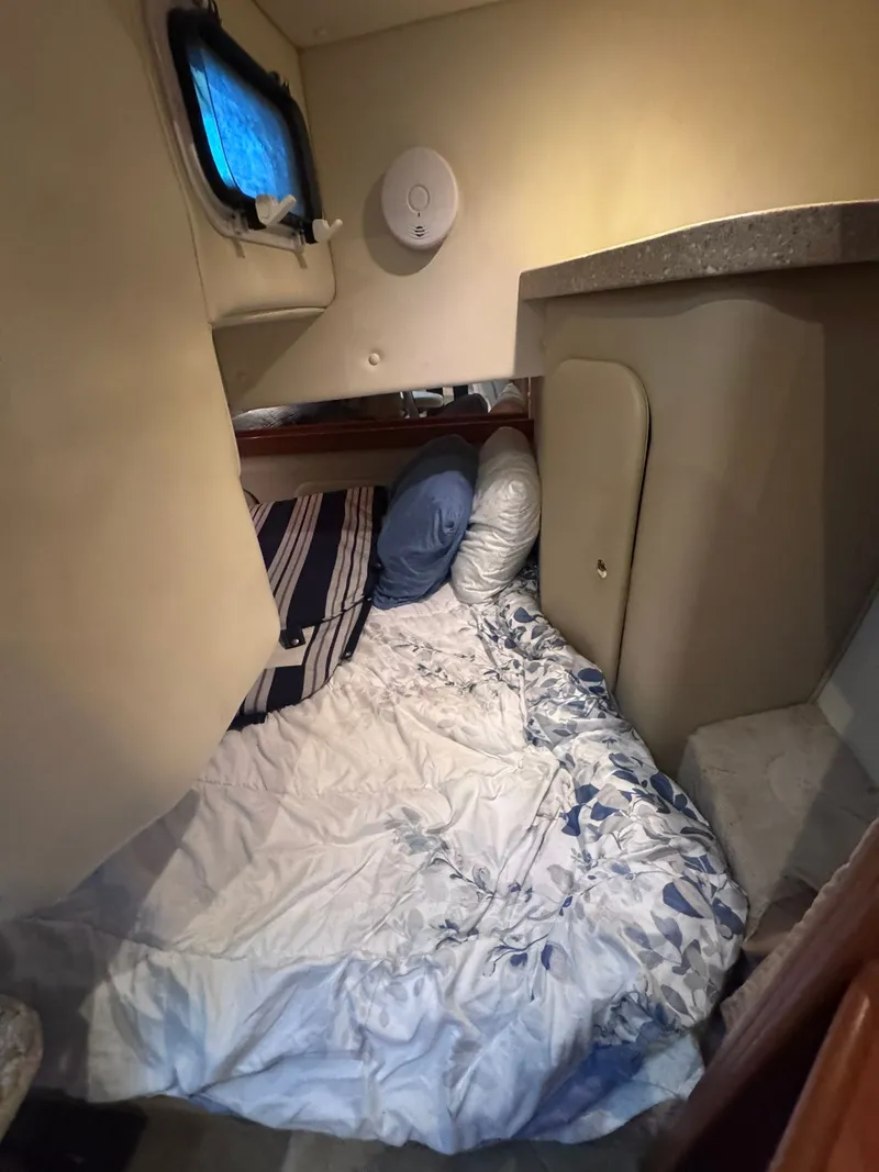 Slide: The Image of Interior of Rinker Fiesta Vee 300 yacht, sleeping area, 2006 model. - 22
