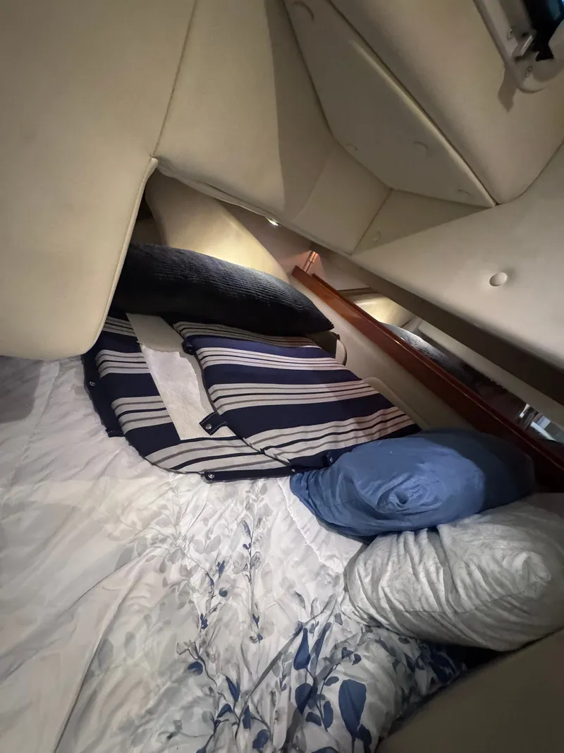 Slide: The Image of Interior of Rinker Fiesta Vee 300 yacht, cozy sleeping cabin, 2006 model. - 23