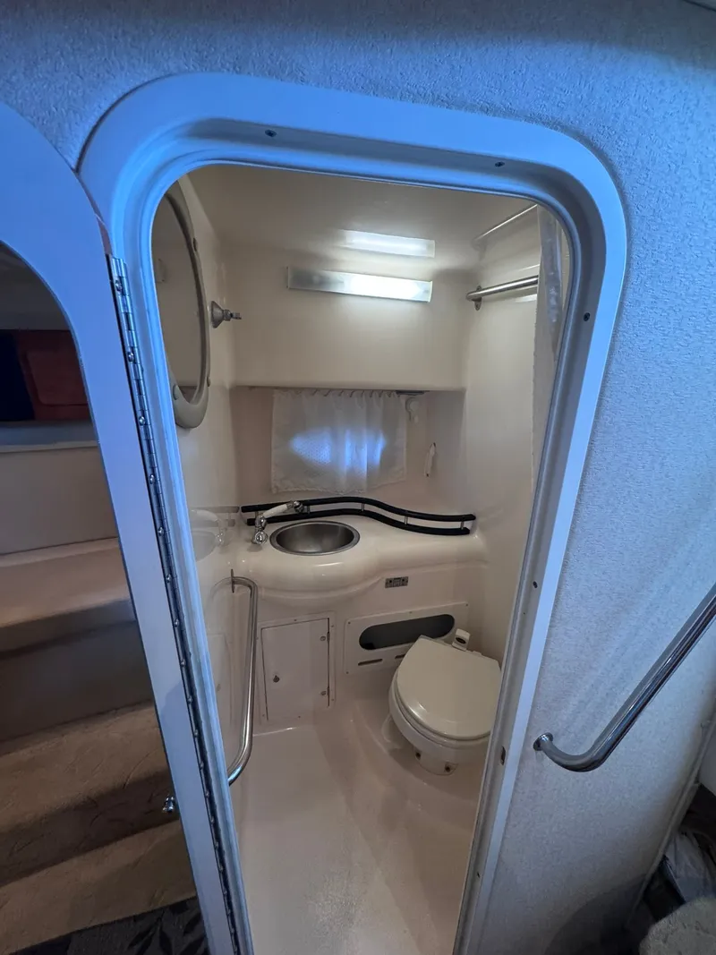 Slide: The Image of Interior view of a 2006 Rinker Fiesta Vee 300 yacht bathroom. - 24