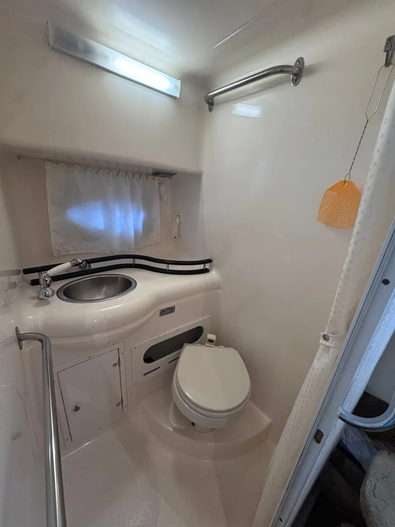 Slide: The Image of Interior of a 2006 Rinker Fiesta Vee 300 yacht, bathroom view. - 25
