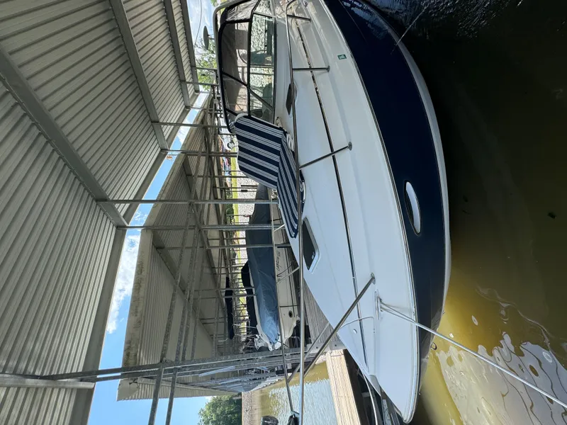 Slide: The Image of 2006 Rinker Fiesta Vee 300 boat docked in marina. - 4