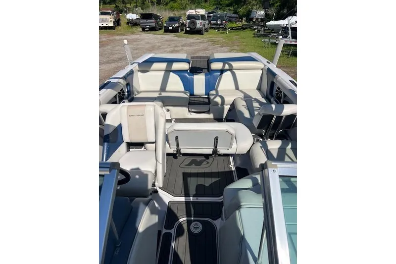 Slide: The Image of 2008 Nautique Super Air Nautique 230 interior with spacious seating and sleek design. - 5