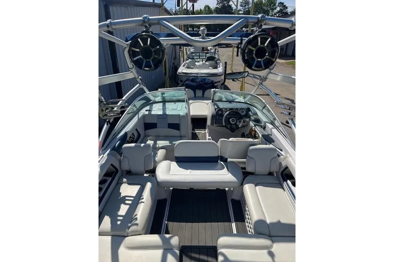 Slide: The Image of 2008 Nautique Super Air Nautique 230 boat interior with seating and speakers. - 7