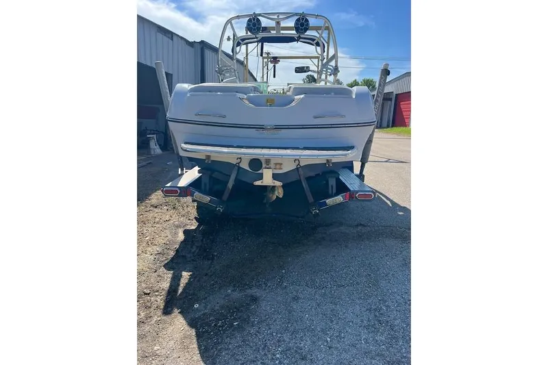 Slide: The Image of 2008 Nautique Super Air Nautique 230 boat rear view in outdoor setting. - 8