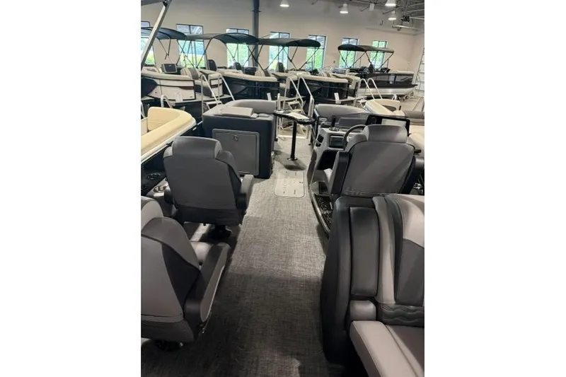 Slide: The Image of Interior of 2026 SunCatcher Elite 322SR pontoon boat with luxurious seating and modern design. - 8