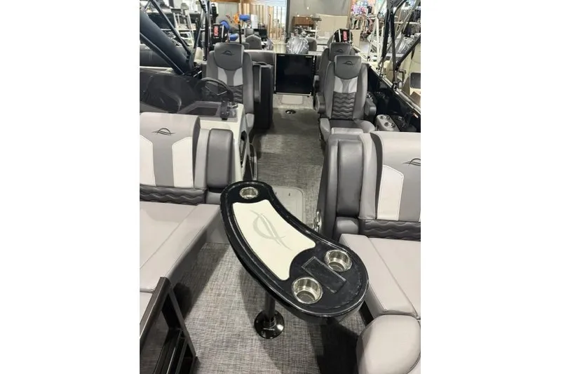 Slide: The Image of 2026 SunCatcher Elite 322SR boat interior with luxurious seating and modern design. - 9