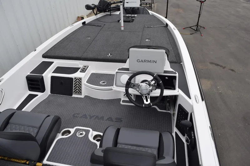 Slide: The Image of 2027 Cayams CX 20 Pro boat interior with Garmin navigation system and sleek seating. - 15
