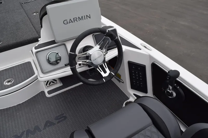 Slide: The Image of 2027 Cayams CX 20 Pro boat cockpit with Garmin navigation and sleek steering wheel. - 16