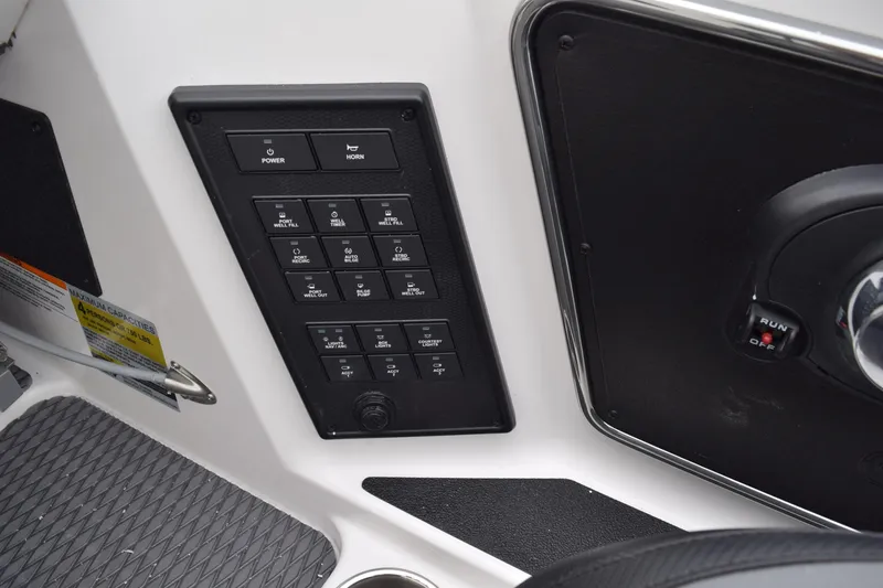 Slide: The Image of Control panel of 2027 Cayams CX 20 PRo boat with switches and ignition. - 17