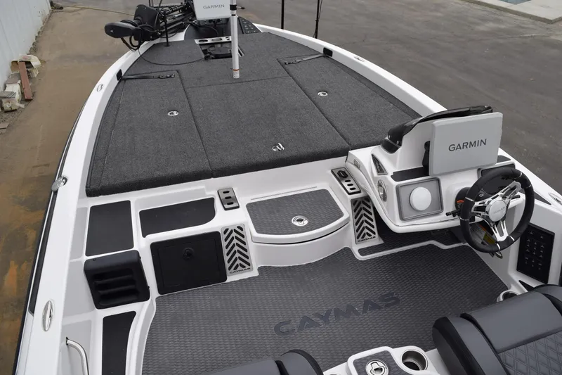 Slide: The Image of 2027 Cayams CX 20 Pro boat interior with Garmin navigation system and spacious deck. - 18