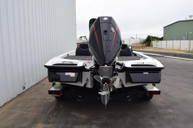 Slide: The Image of 2027 Cayams CX 20 PRo boat rear view with powerful outboard motor. - 20