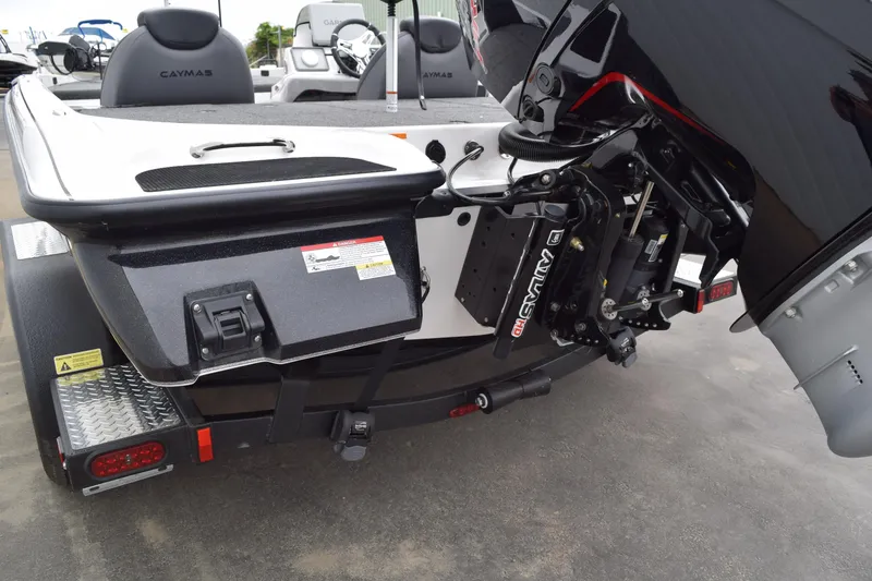 Slide: The Image of 2027 Cayams CX 20 Pro boat trailer with motor and equipment details. - 21