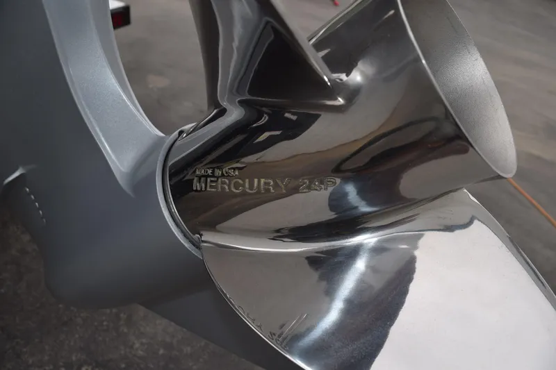 Slide: The Image of Close-up of a Mercury 24P propeller on a 2027 Cayams CX 20 PRo boat. - 22
