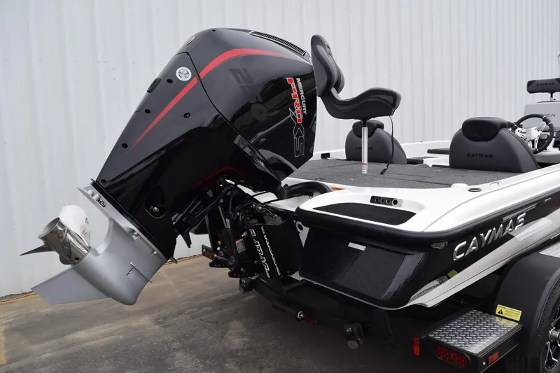 Slide: The Image of 2027 Cayams CX 20 Pro boat with Mercury Pro XS engine, parked outdoors. - 24