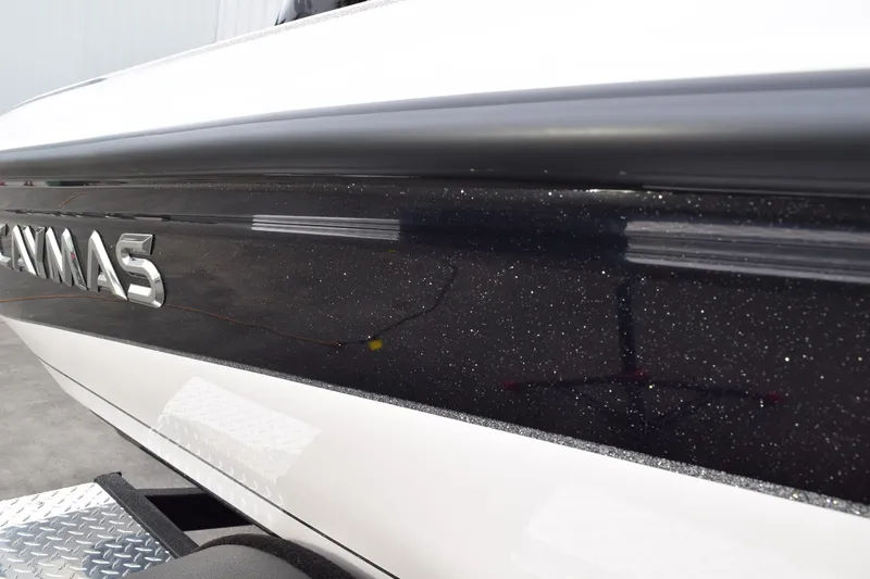 Slide: The Image of 2027 Cayams CX 20 PRo boat with sleek black and white exterior design. - 6