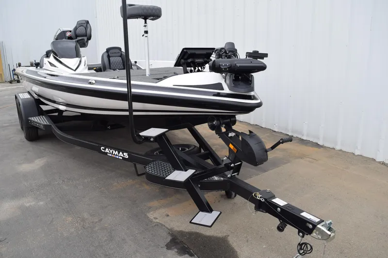 Slide: The Image of 2027 Cayams CX 20 Pro boat on trailer, parked outdoors. - 7
